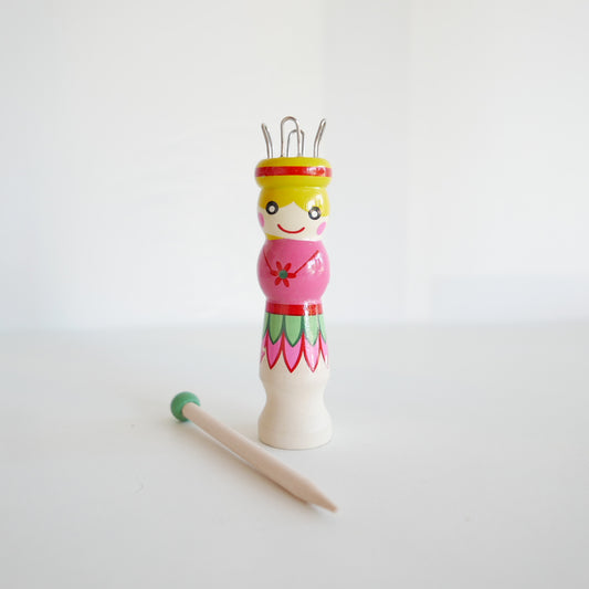 Wooden French knitting dolly and needle, suitable for kids’ craft activities, isolated on white backdrop