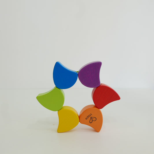 Colorful wooden toy with rainbow pattern