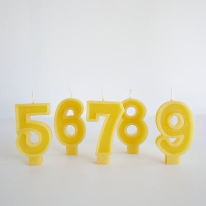 Set of yellow beeswax number candles for birthdays

