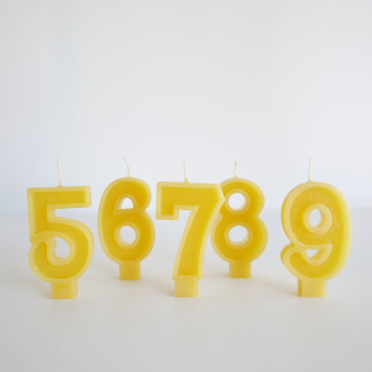 Set of yellow beeswax number candles for birthdays

