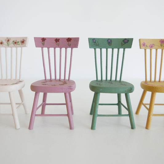 Dolls house accessory — pale dining chair with simple, elegant design, ideal for miniature dining rooms, isolated on white