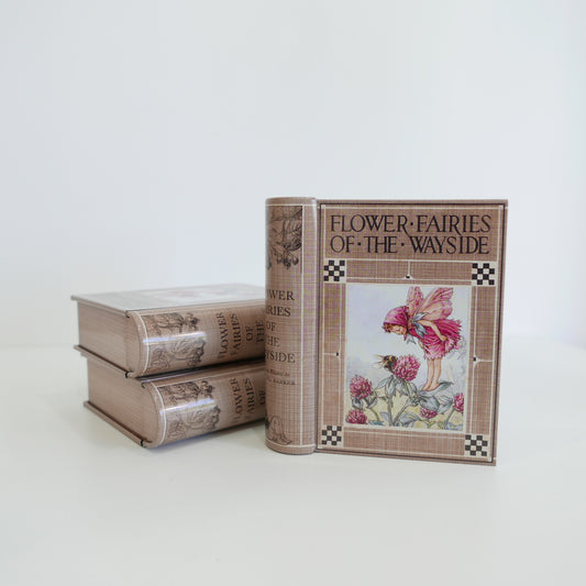Two books titled 'Flower Fairies of the Wayside' on a white background