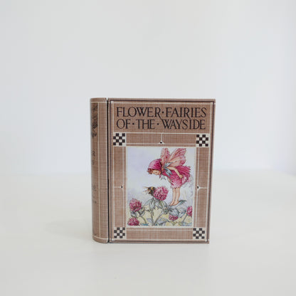 Book titled 'Flower Fairies of the Wayside' with a fairy illustration on the cover against a white background