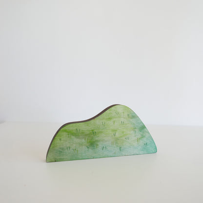 Green decorative piece on a white background