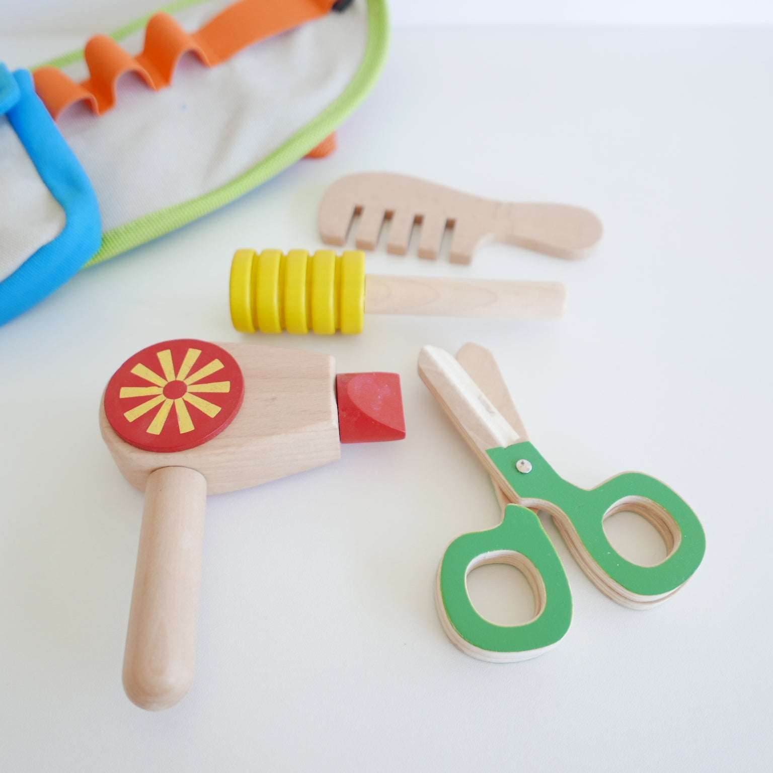 Set of colorful wooden tools on a white background