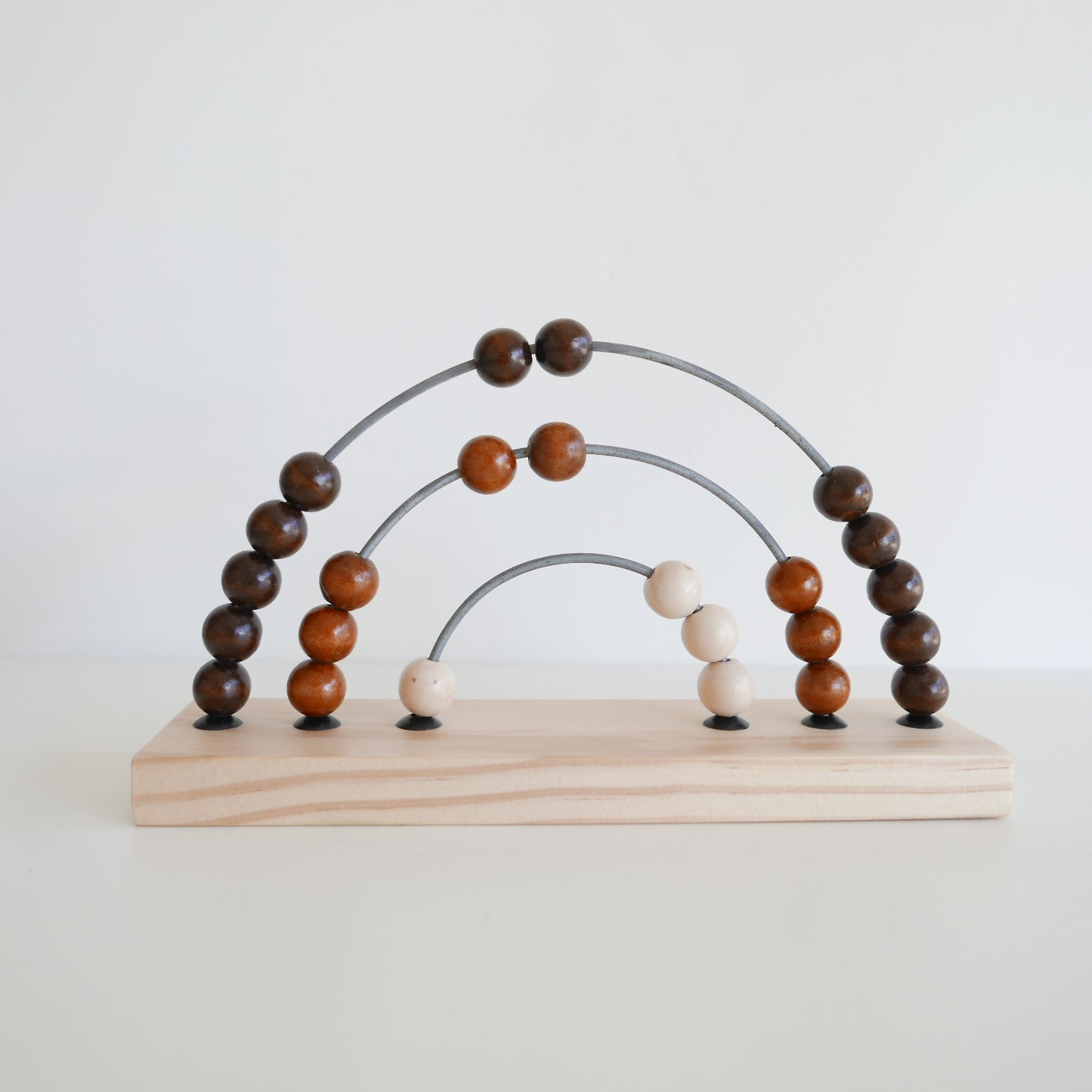 Wooden abacus toy with brown and beige beads 