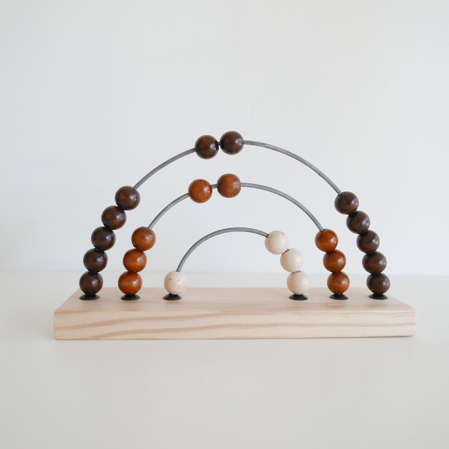 Wooden abacus toy with brown and beige beads 
