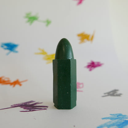 Focus on green Cognito crayon with scribble background

