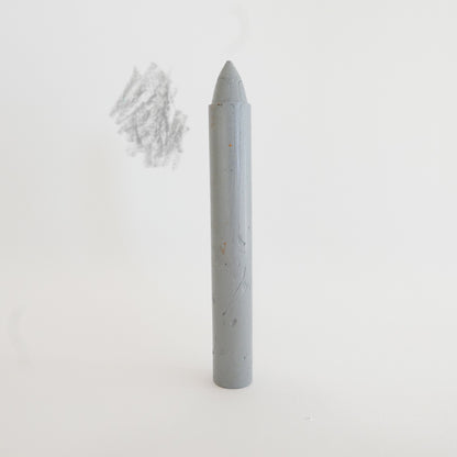 Gray cylindrical crayon on a white background