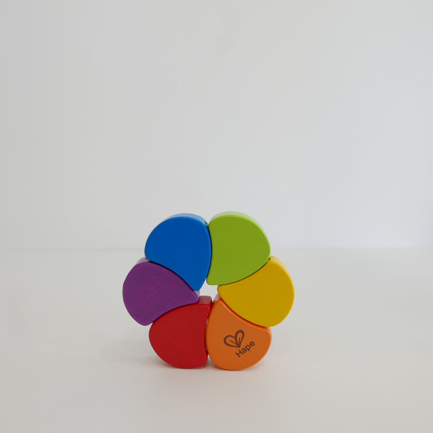 Colorful wooden toy with rainbow pattern 