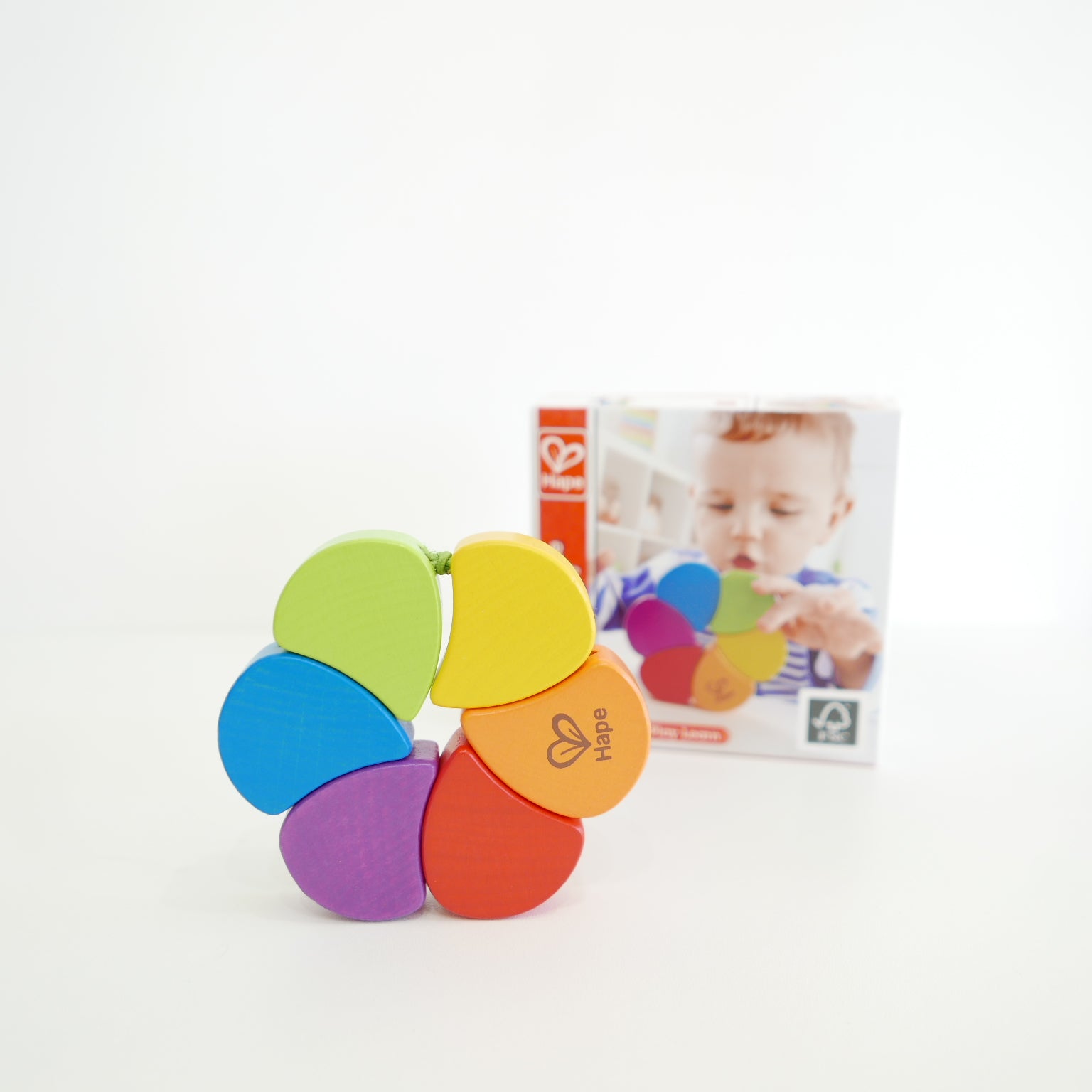 Colorful wooden toy with rainbow pattern 