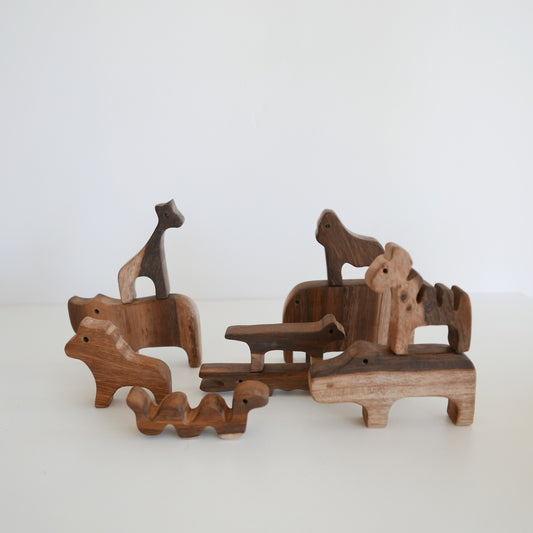 Set of wooden animal toys on a white background