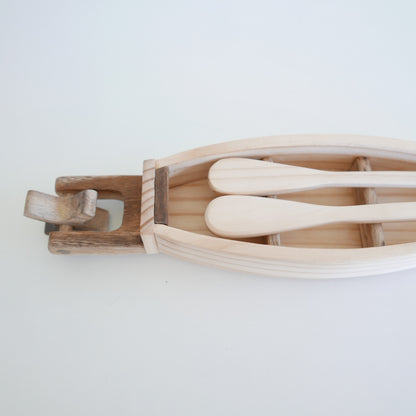 wooden toy boat with oars for play