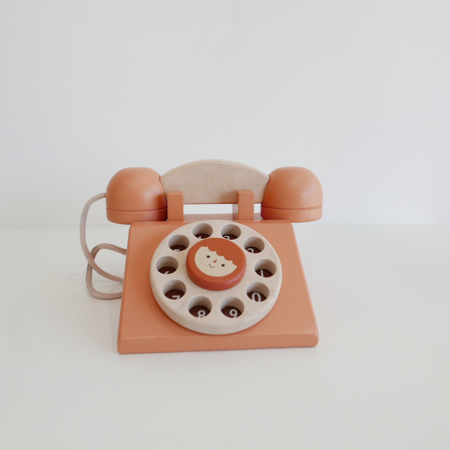Wooden Toy telephone with a rotary dial