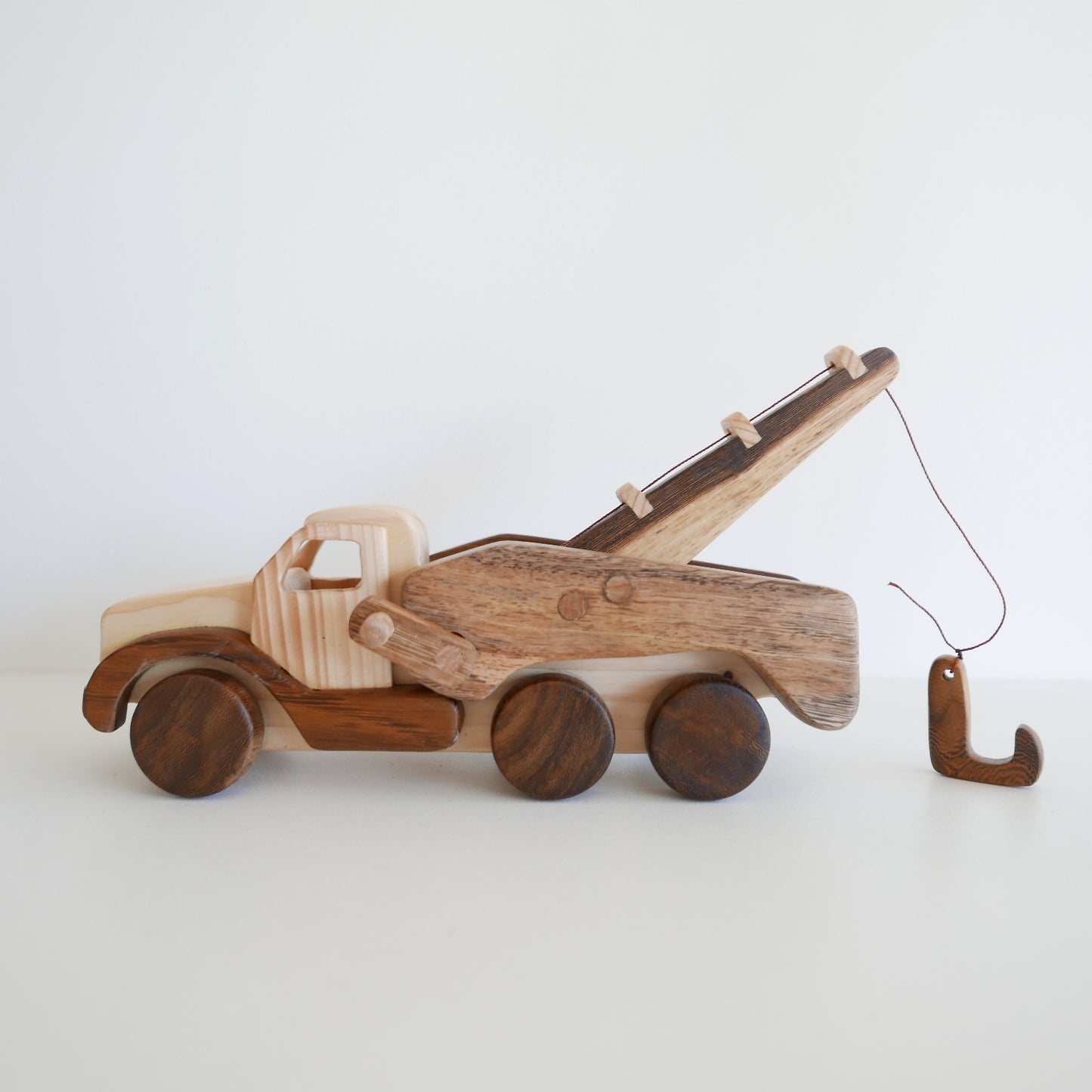 Wooden toy truck with a flatbed and crane for kids