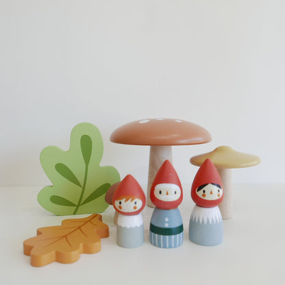 Wooden toy figures of gnomes and mushrooms 